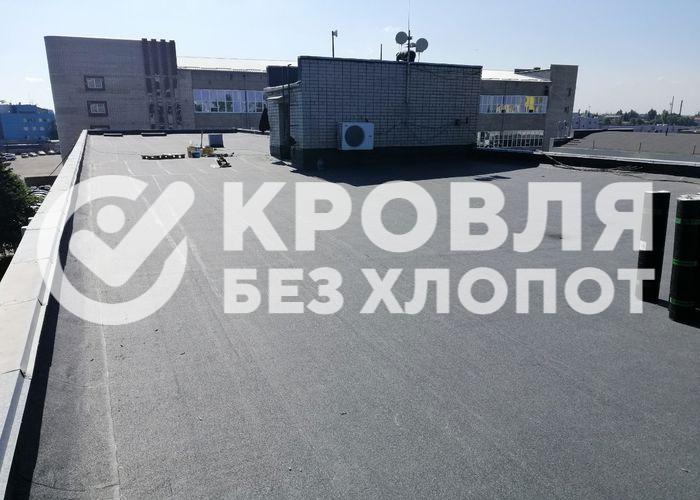 Монтаж плоской кровли многоквартирного дома